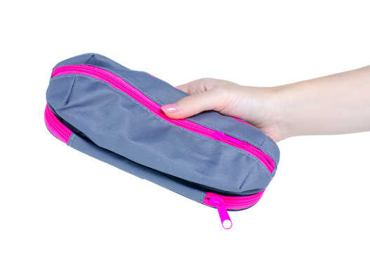 School pencil case in hand on white background isolation