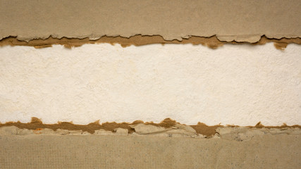 paper abstract in earth tones  with a copy space - sheets of bark and cotton rag paper, blank web banner