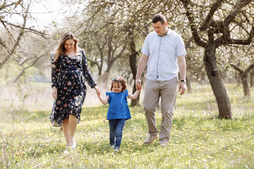 Fototapeta premium happy young family spending time outdoor on a summer day.
