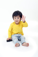 South East Asian young boy child playing happy waving hand at camera on white background
