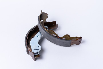 New brake pads for disc brakes on a wooden table.