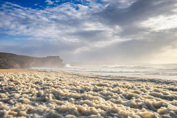 Restless sea at North Beach of famous Nazare, Portugal