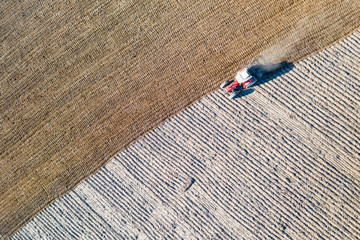 Photograph of an agricultural tractor plowing a field