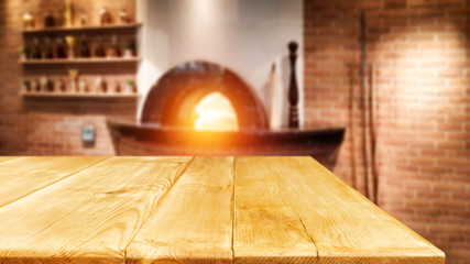 Table background of free space and home interior with fireplace 