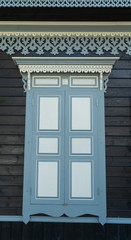 the old wooden window with closed shutters