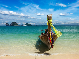 Long tail boat on beach, Thailand