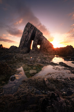 Sunset at Vallina beach amazing rocky beach at the coast of Asturias, north of Spain.