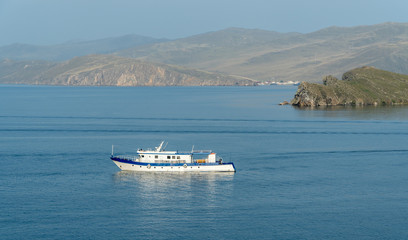 small vessel on a large lake. concept of travel. Lake Baikal is the largest freshwater lake in the world.