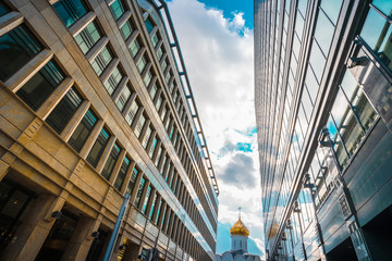 Naklejka premium Glass roofs of business centers are photographed against the blue sky