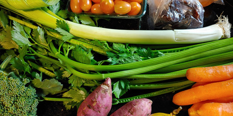 A small variety of fruits and vegetables that have just arrived from the organic fair.