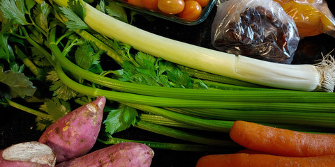 A small variety of fruits and vegetables that have just arrived from the organic fair.