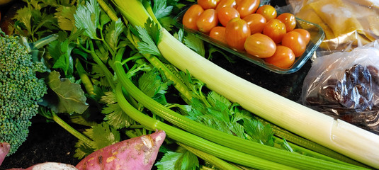 A small variety of fruits and vegetables that have just arrived from the organic fair.