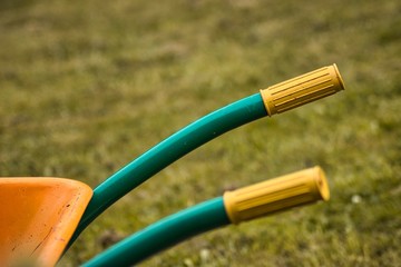 Green and yellow wheelbarrow.