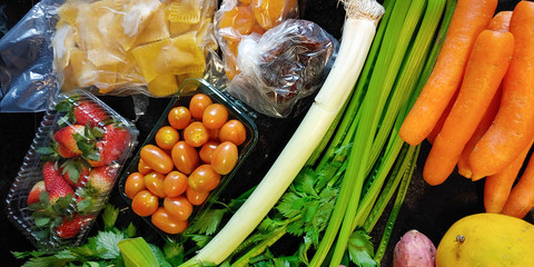 A small variety of fruits and vegetables that have just arrived from the organic fair.