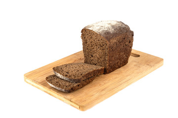Pieces of rye bread cut off from a loaf.