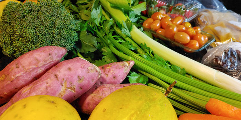 A small variety of fruits and vegetables that have just arrived from the organic fair.