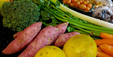A small variety of fruits and vegetables that have just arrived from the organic fair.