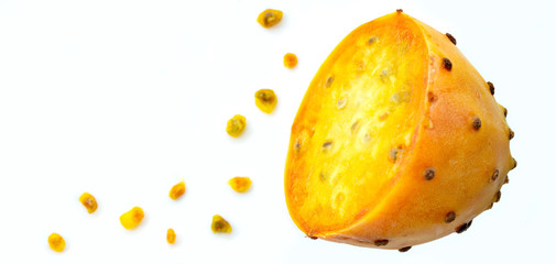 Prickly pear fruit in half across isolated on white background. Fresh sliced prickly pear and a lot of seeds with copy space. Sabra fruit. neon fruits - nopales cactus