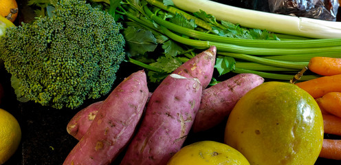 A small variety of fruits and vegetables that have just arrived from the organic fair.