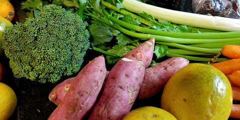 A small variety of fruits and vegetables that have just arrived from the organic fair.