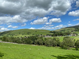 Landscape view, looking toward Kettlewell, with fields, trees, and hills near, Kettlewell, Skipton, UK