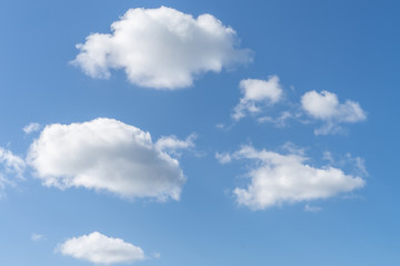 Naklejka na ściany i meble White clouds in blue sky background