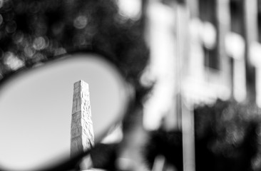 Obelisco dell'EUR riflesso in uno specchietto (Roma Italia)