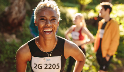 Cheerful cross country marathon runner - Powered by Adobe