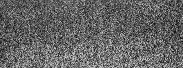 Top view of colorful dark grey gray anthracite deep pile carpet / rug texture background banner