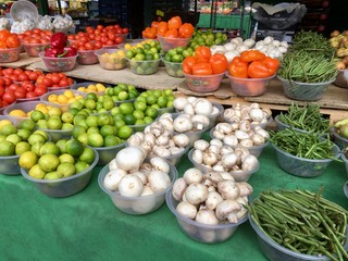 Mushrooms and limes on display at a farmers market - UK