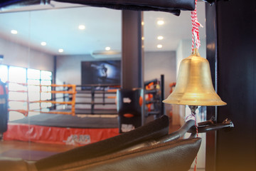 Empty boxing ring and bell