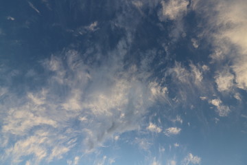 Naklejka na ściany i meble Clouds in blue sky. Sky with fluffy clouds background