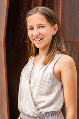Fototapeta premium Portraits of a young lady on a warm summer day. 