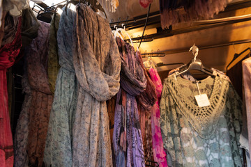 Fototapeta na wymiar Dresses and Pashminas on Market Stall