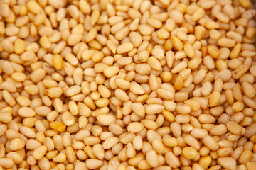 Background of peeled pine nuts.