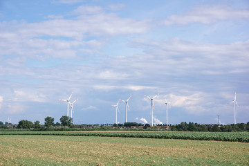 Windmills near the village. Windmills in the autumn field.