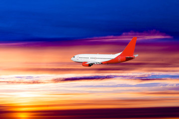 Fototapeta na wymiar airplane on sunset background. Passenger airliner. Commercial aircraft. Private jet