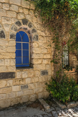 Fototapeta na wymiar Old and picturesque houses along Rosh Pina historic and reconstructed street from the 19th century, town of Rosh Pina, Upper Galilee, Israel.