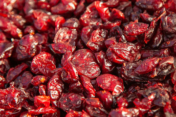 Closeup dried cranberries. The flavors of Taiga - Altai dried berries at a rural fair