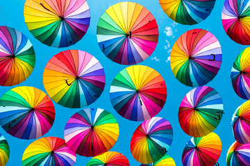 Fototapeta na wymiar Colorful umbrellas. rainbow umbrellas background