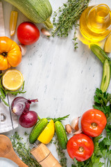 Fresh raw vegetables and ingredients for cooking. Top view with copy space for your recipe. Shopping list, diet plan.