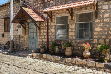 Old and picturesque houses along Rosh Pina historic and reconstructed street from the 19th century, town of Rosh Pina, Upper Galilee, Israel.