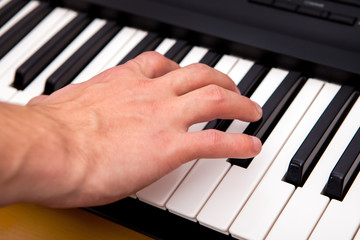 Hand and Piano Keyboard