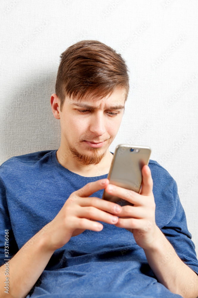 Poster young man with a phone