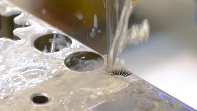 Automatic cnc wire cutting machine working with sheet metal with sparks at factory, plant: slow motion. Metalworking, industrial, machining, technology, manufacturing, equipment concept