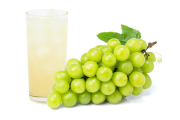 Green grape with glass of grape juice isolated on white background.