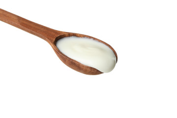 Spoon with sour cream yogurt isolated on white background