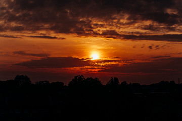 Beautiful sunset. Orange sunset. The moon at sunset