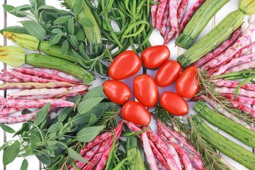 geometric composition of fruits and vegetables on white table top view