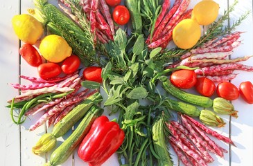 geometric composition of fruits and vegetables on white table top view